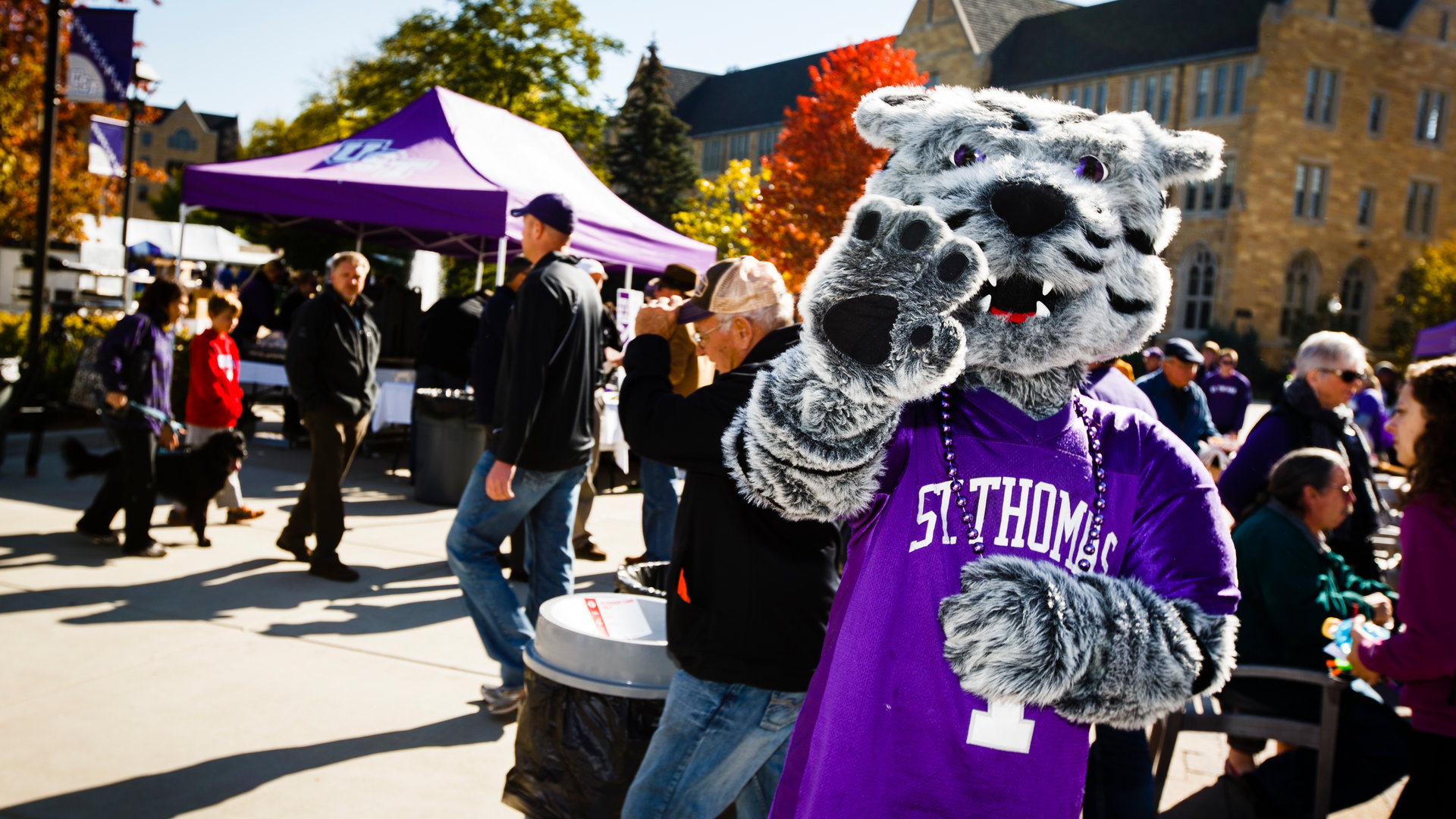 Tommie waves a the camera during an event on campus